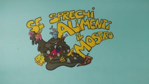 Murales mensa Winkler: "Se sprechi alimenti il mostro"